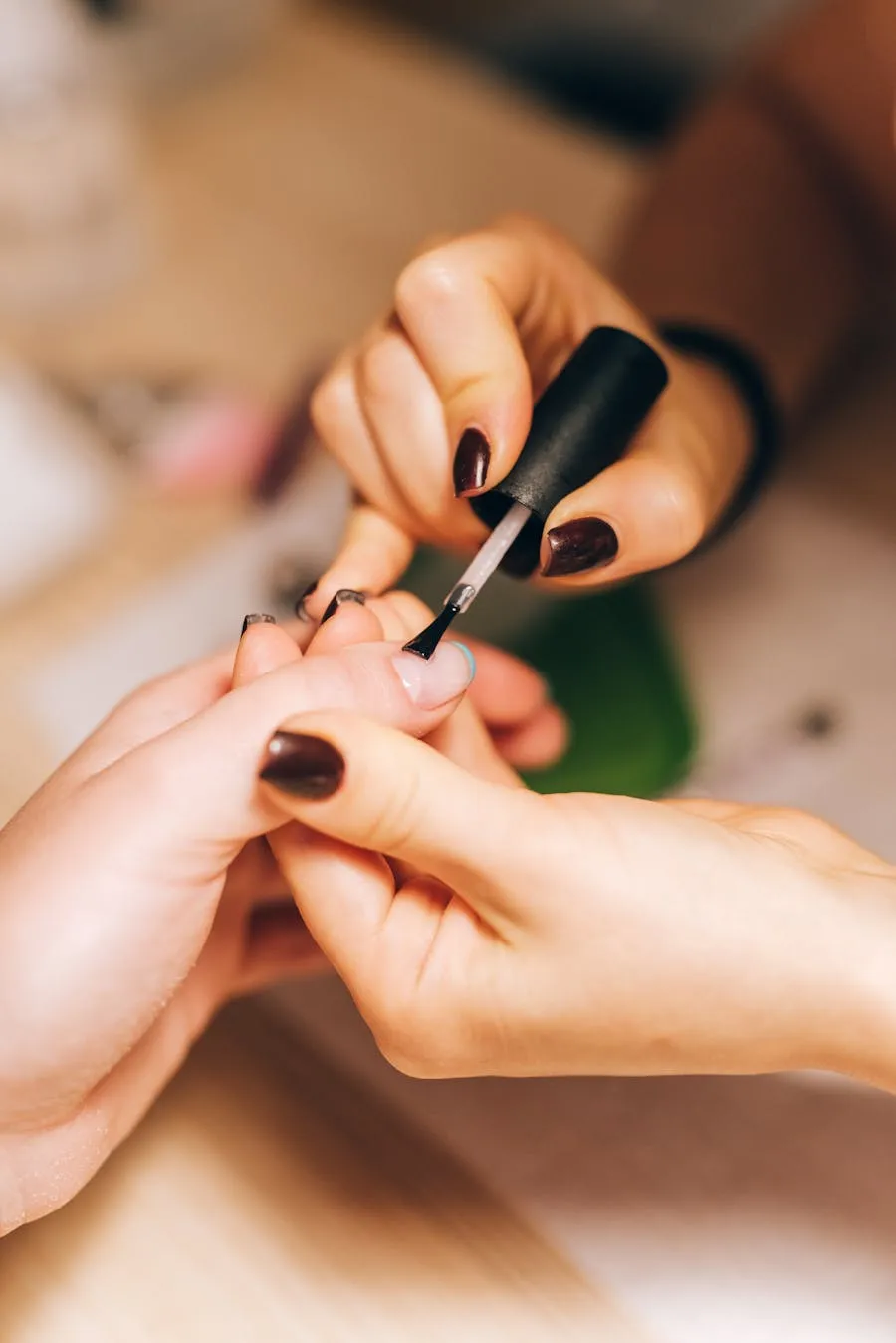 Glossy espresso brown nails mid application