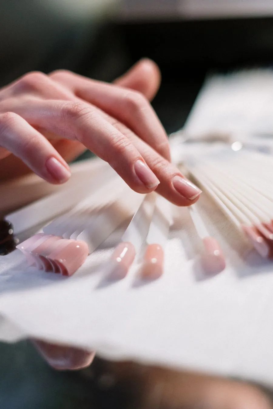 Sheer nude almond nails with white florals
